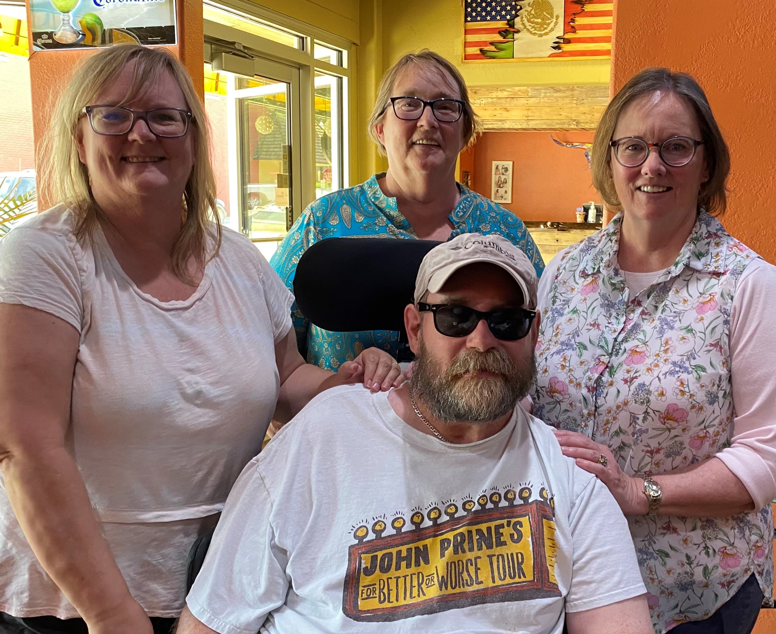 Mary with her brother, Chris, and sisters 